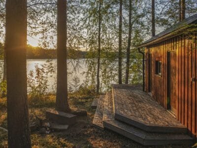 a cabin in the woods near a lake