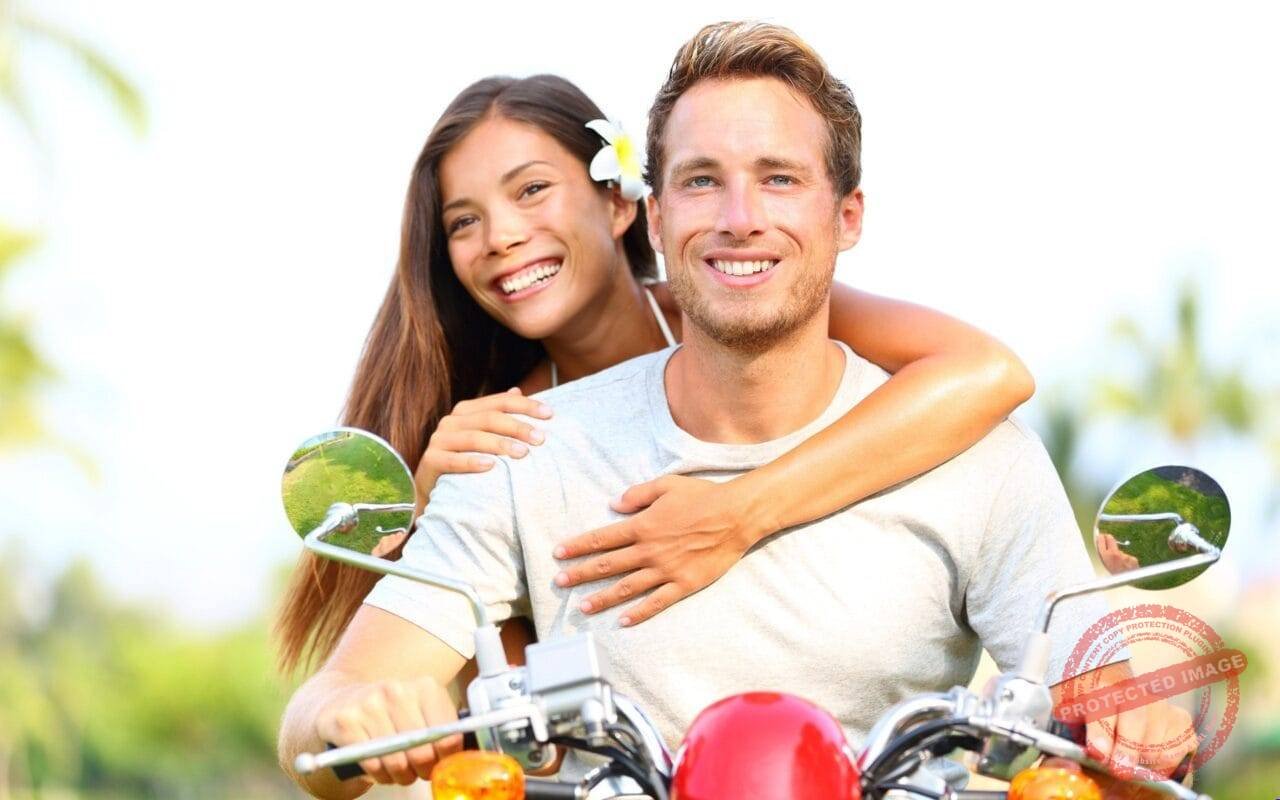 Beautiful Couple Happy On Bike