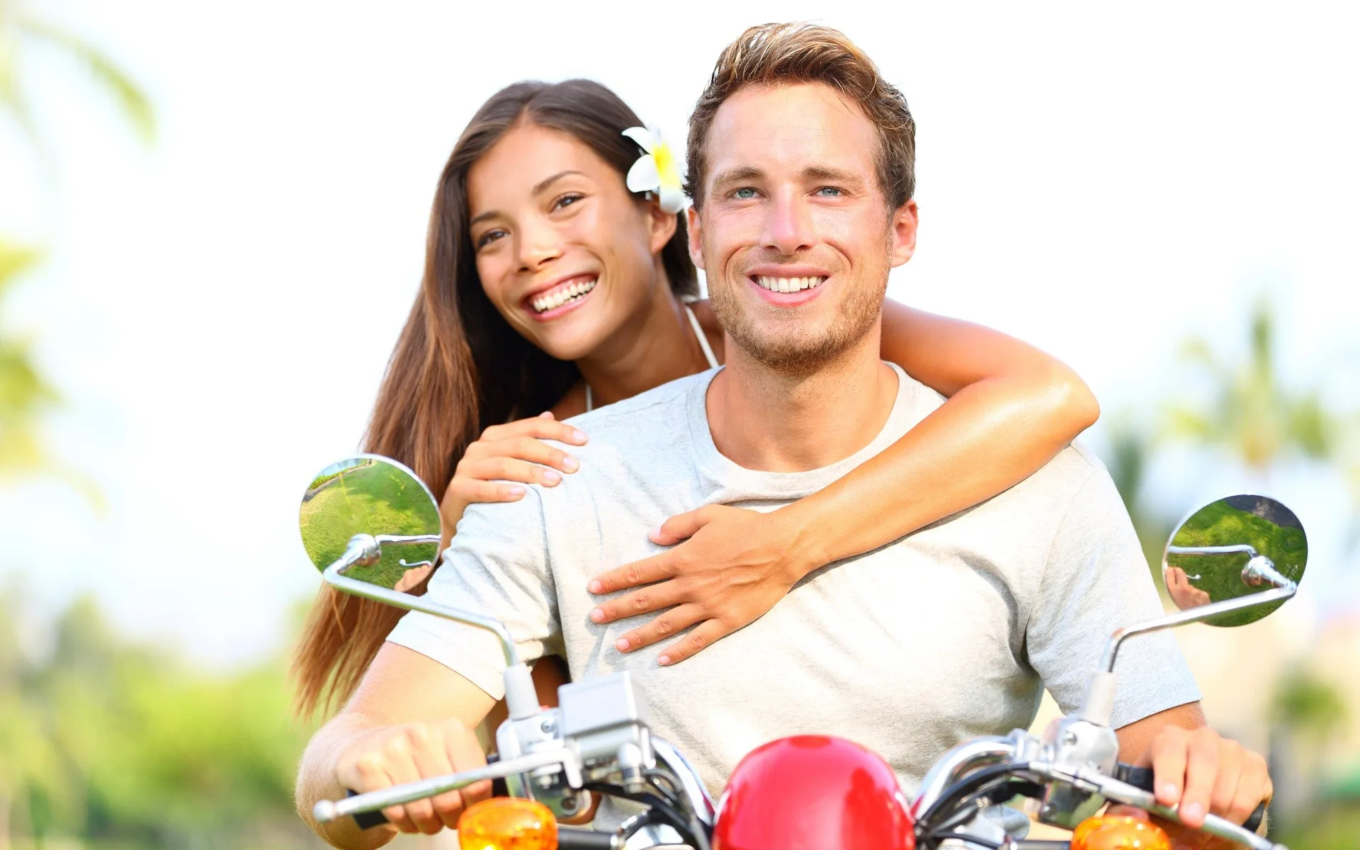 Beautiful couple happy on bike Straipsniai.lt
