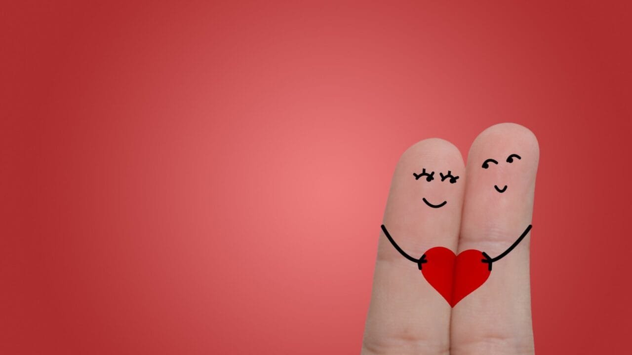 Couple of fingers join by heart love images