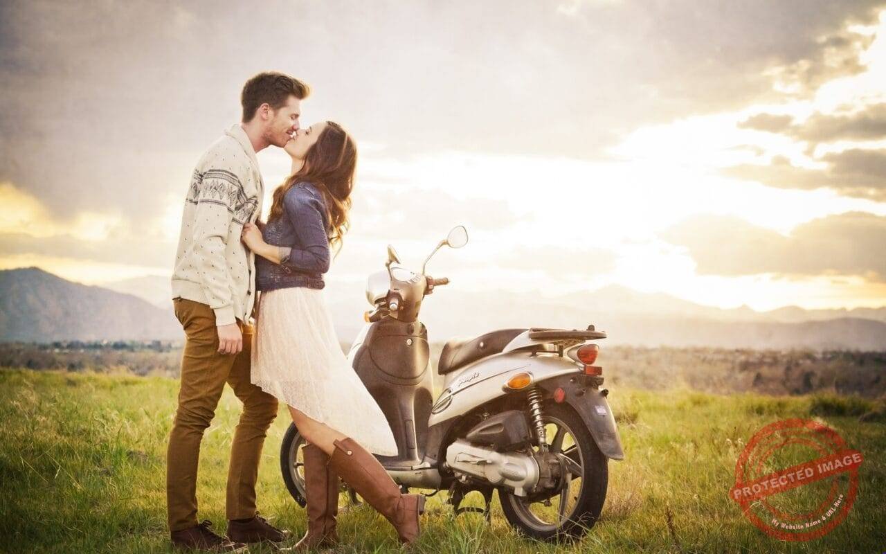 Couple with bike at sunset time romantic moods