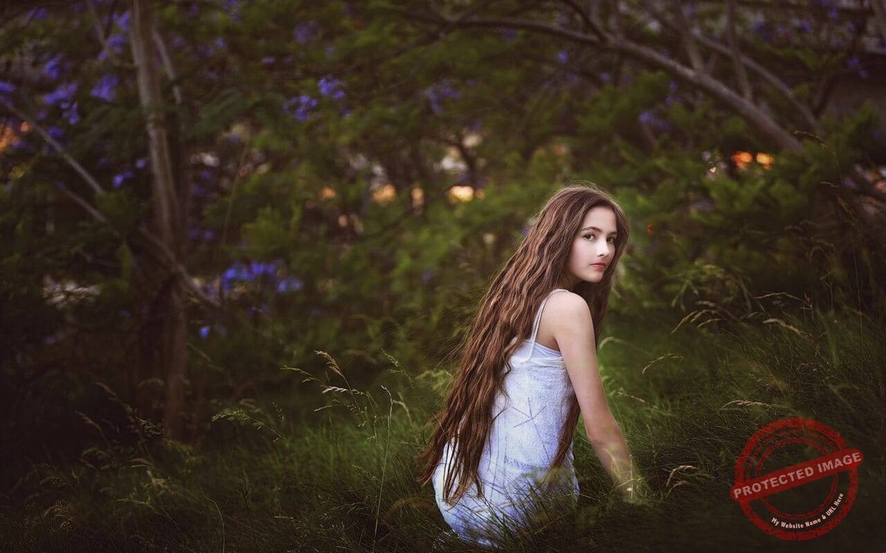 Girl in the grass long hair look nature