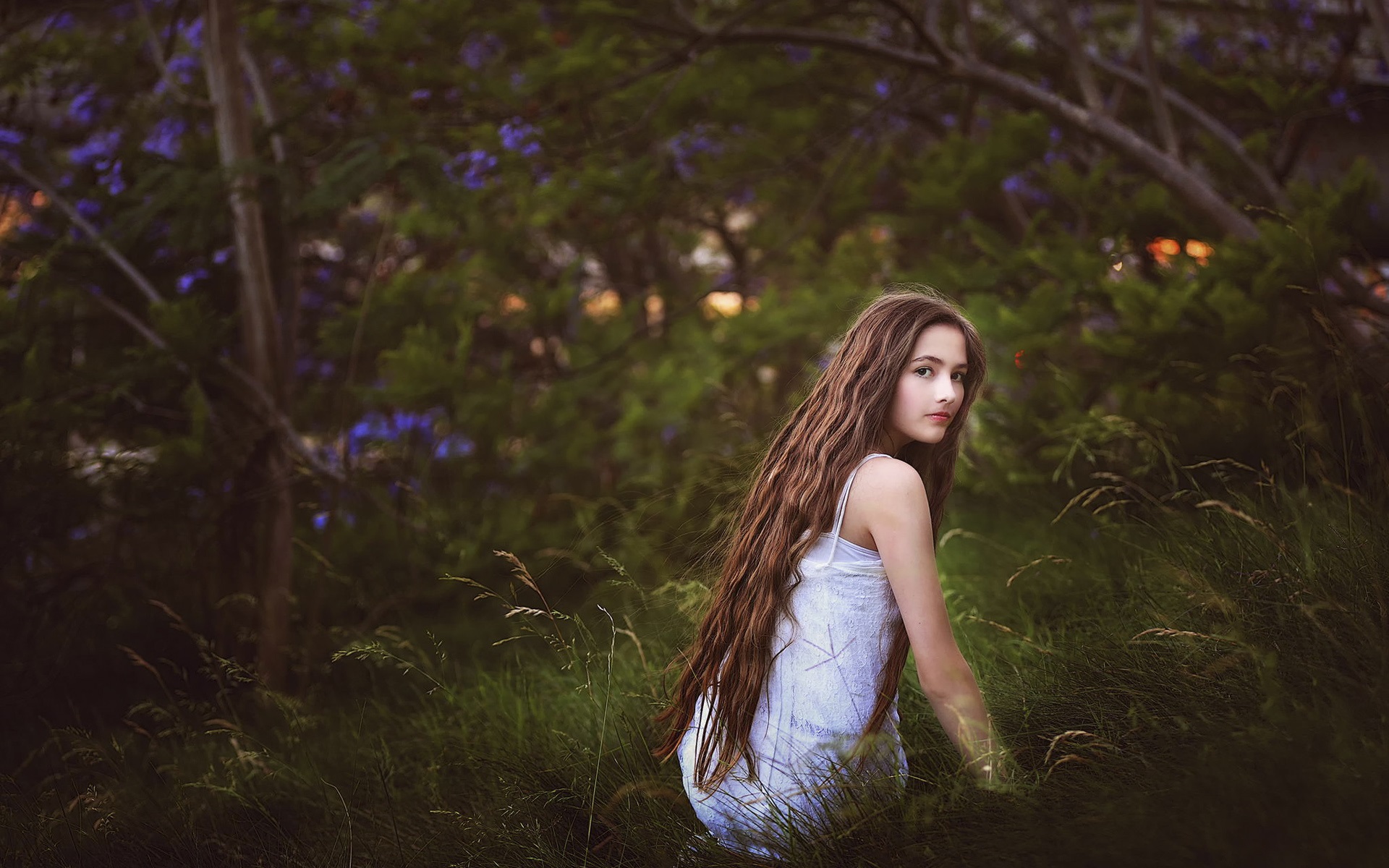 Girl in the grass long hair look nature Straipsniai.lt