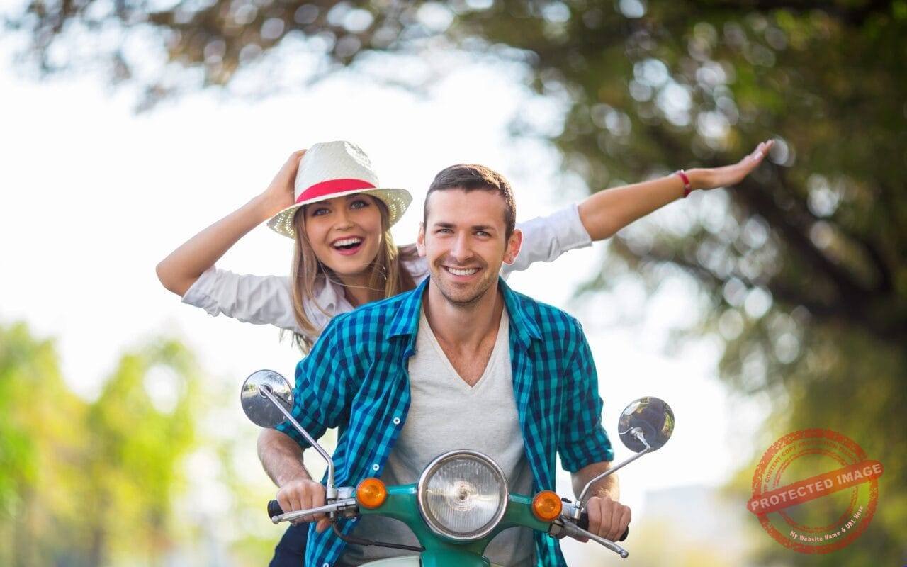 Happy and crazy couple on scooter