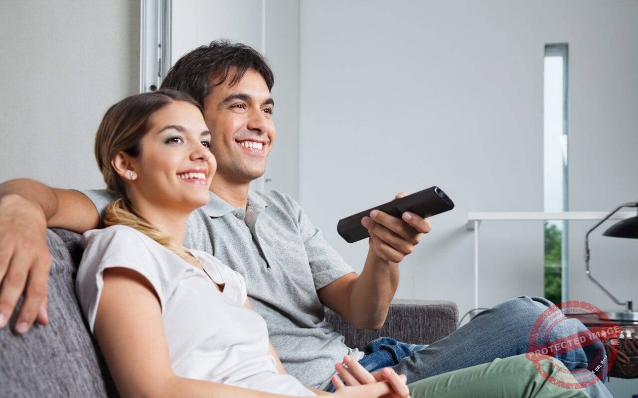 Happy Couple Watching TV