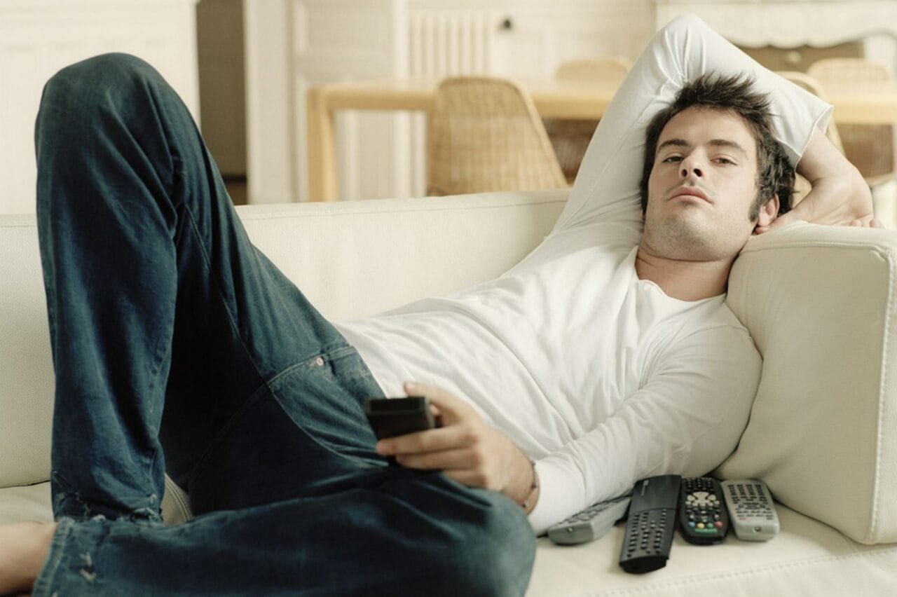 Man Relaxing On Sofa