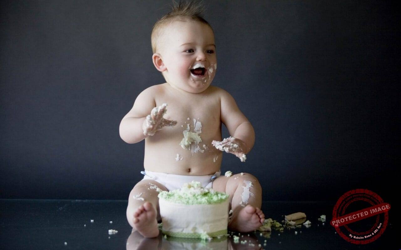 Naughty baby happy with cake