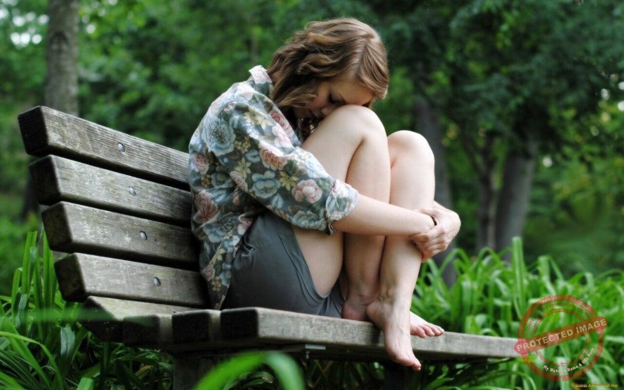 Sad Girl Sitting On The Bench