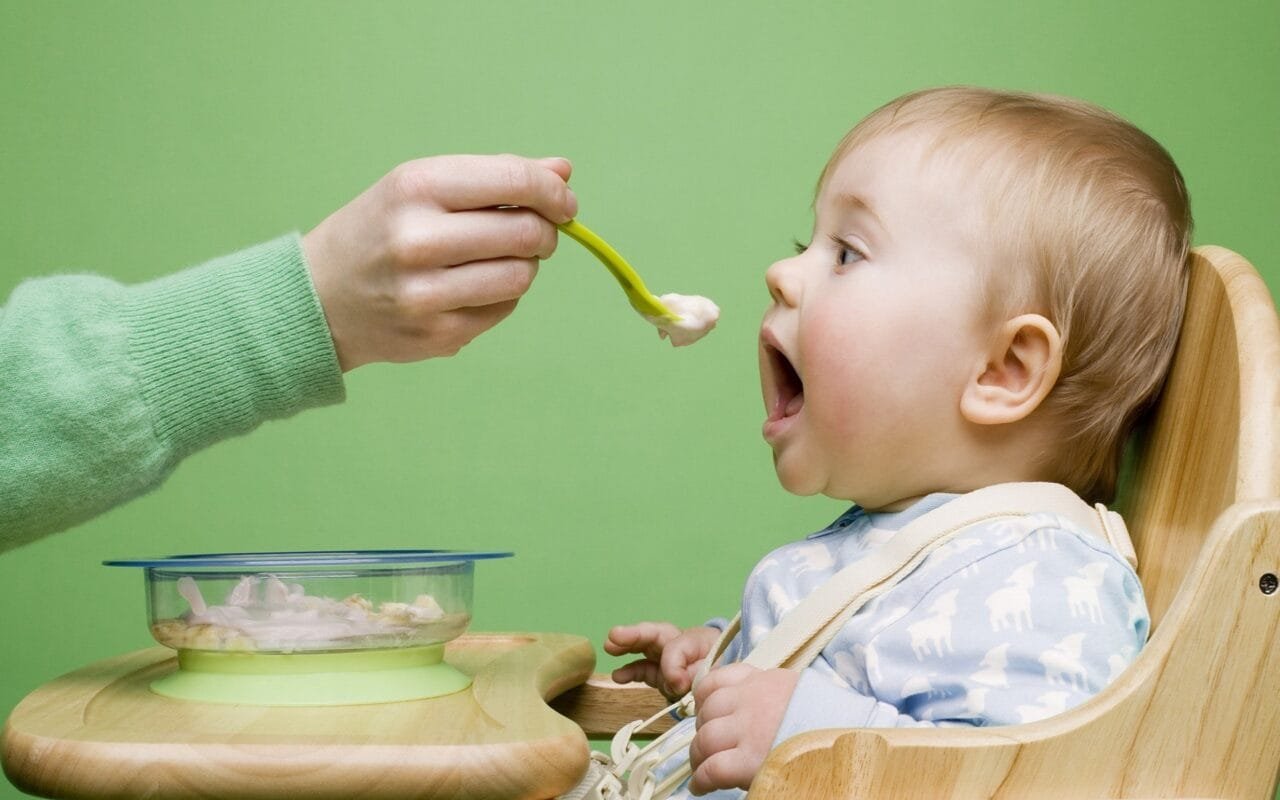 Baby eating food funny