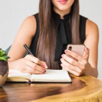 business-woman-writing-from-phone_23-2148218602