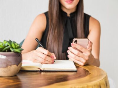 business-woman-writing-from-phone_23-2148218602