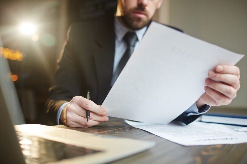 businessman-working-with-documentation-desk_1098-15981