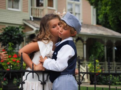 closeup-shot-little-girl-kissing-boy-cheek_181624-20468