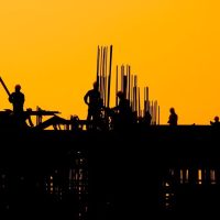 construction-workers-sunset_53876-138180