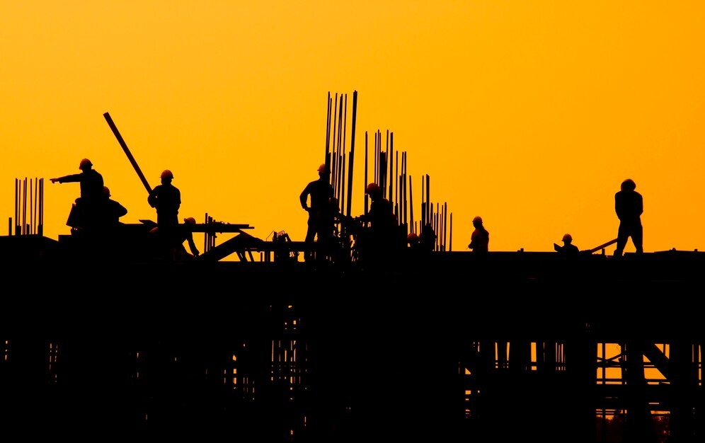 construction-workers-sunset_53876-138180