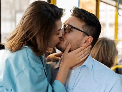 couple-kissing-public-transportation-side-view_23-2149627982