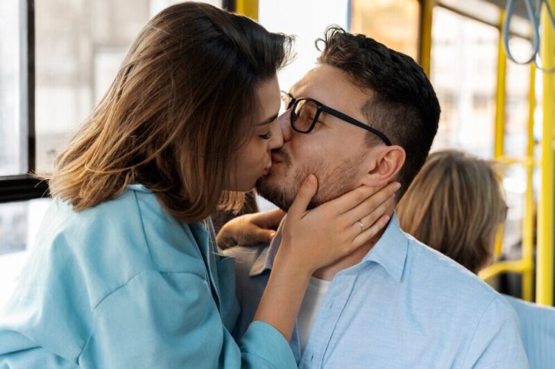 couple-kissing-public-transportation-side-view_23-2149627982