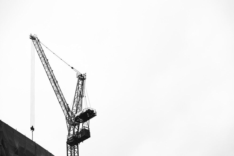 crane-sky-construction-site_53876-95425