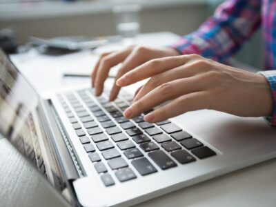 cropped-view-hands-typing-laptop_1262-3196