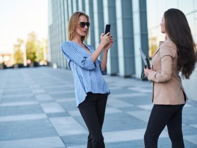 curious-journalist-is-taking-interview-from-successful-businesswoman-street_613910-14016