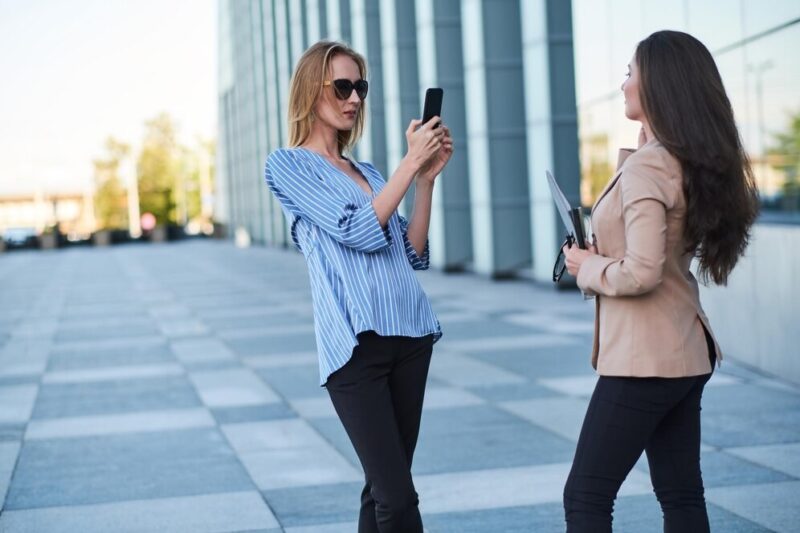 curious-journalist-is-taking-interview-from-successful-businesswoman-street_613910-14016