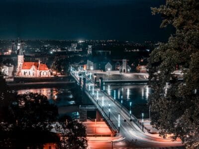 a view of a city at night from a hill