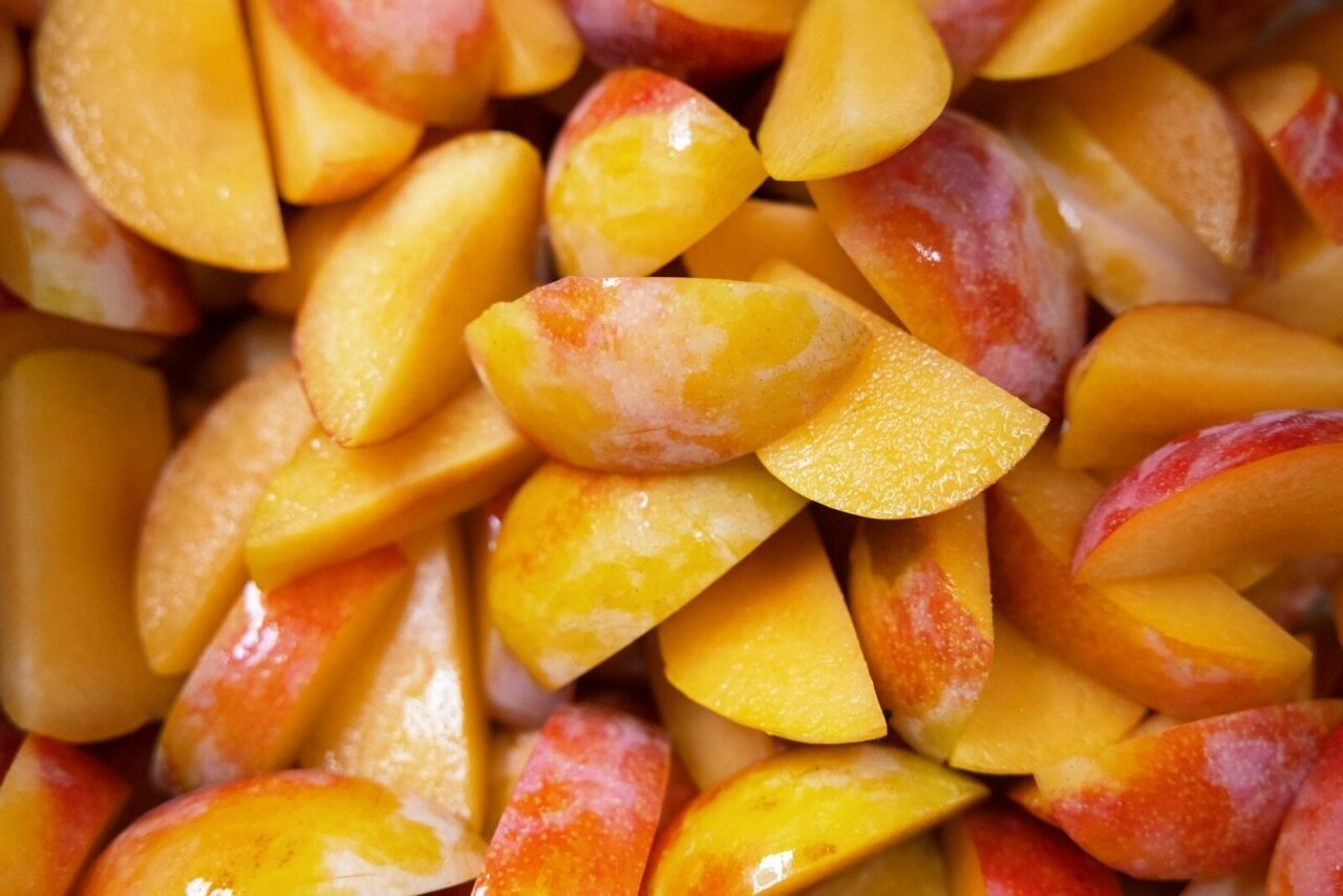 a pile of sliced peaches sitting on top of each other