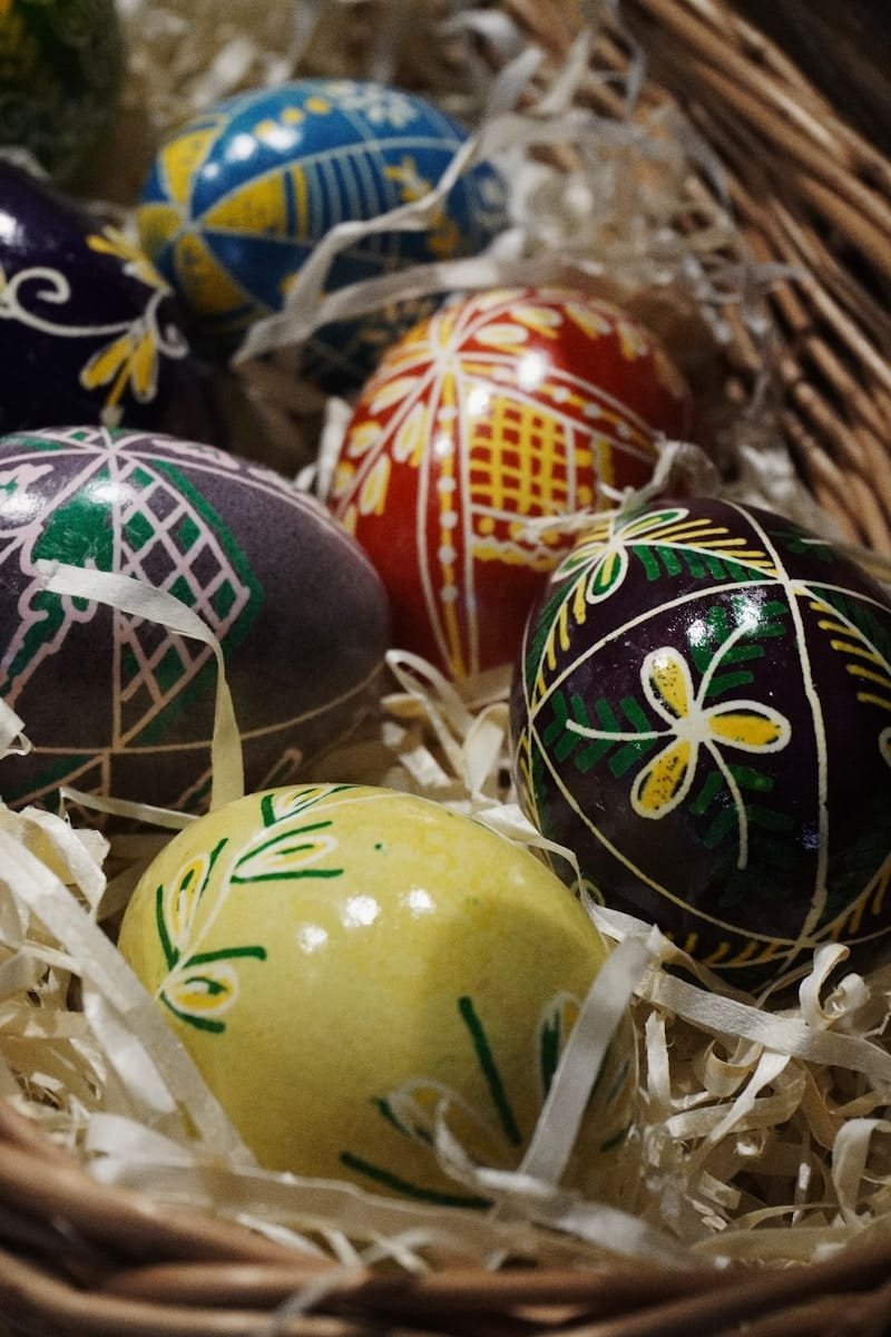 a basket filled with different colored easter eggs