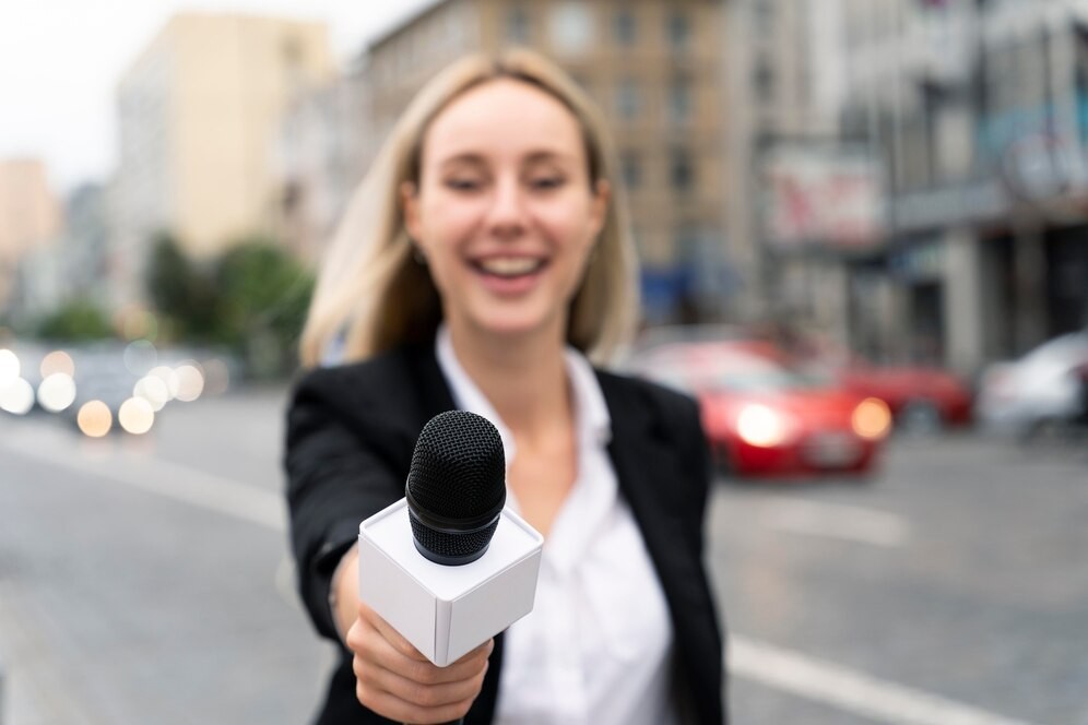 front-view-journalist-holding-microphone_23-2149032386