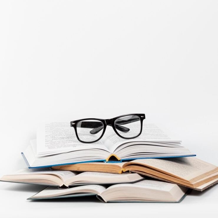 front-view-open-books-with-glasses_23-2148255840