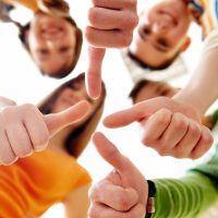 happy-group-friends-with-thumbs-up_1098-1279