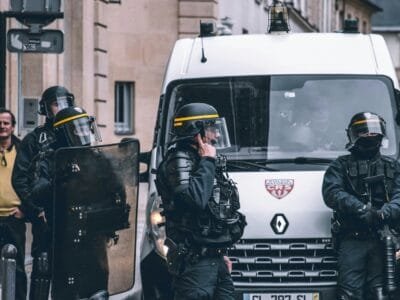 white Renault van and people standing beside it