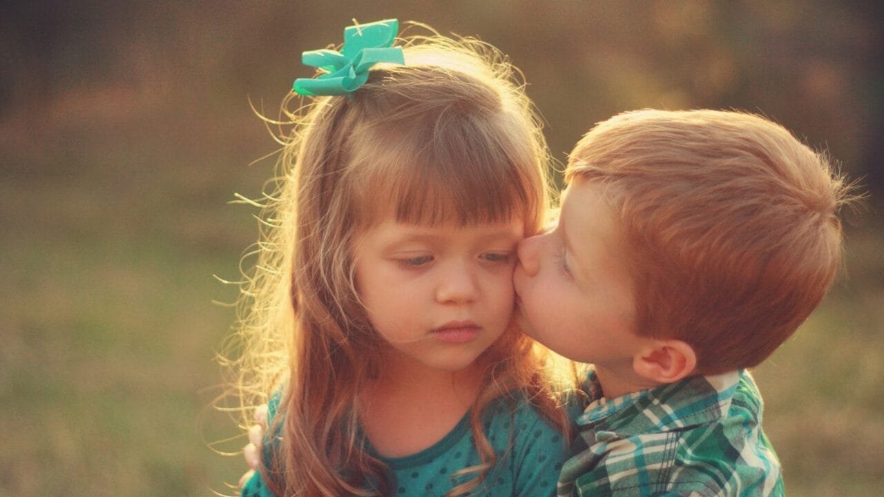 Little couple childhood kiss