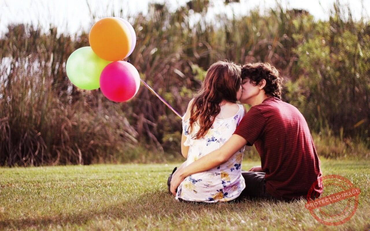 Lovely Couple Kissing In Nature