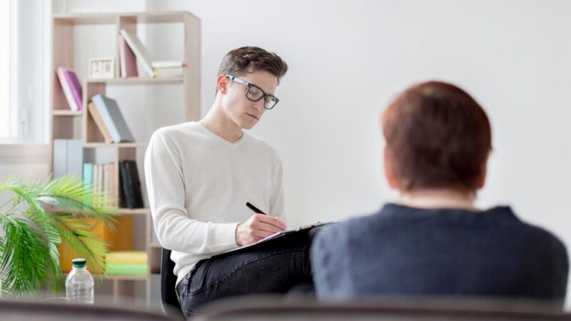 low-angle-woman-psychologist_23-2148567379