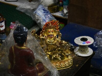 a gold statue on a table