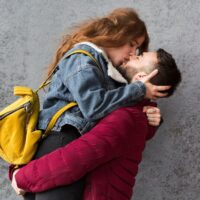 man-kissing-his-woman-medium-shot_23-2148375452