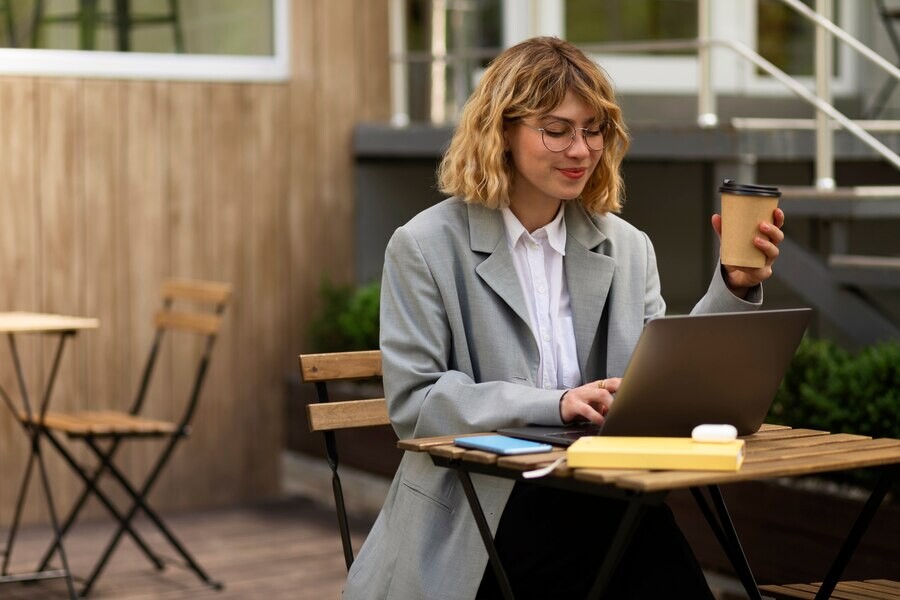 medium-shot-woman-working-laptop