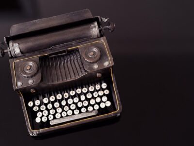 old-typewriter-black-glass-background-mock-up-ready-design_158595-7980