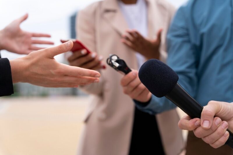 people-taking-interview-outdoors_23-2149032369