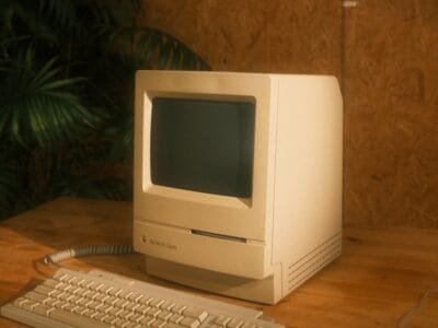 a desktop computer sitting on top of a wooden desk