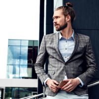 portrait-sexy-handsome-man-dressed-elegant-gray-checkered-suit