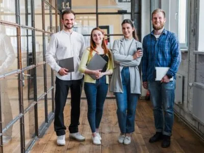 portrait-smiling-businesspeople-standing-office
