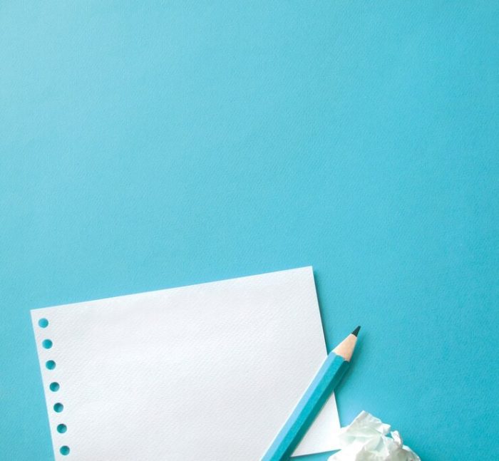 sheet-paper-pen-with-blue-background_53876-41374