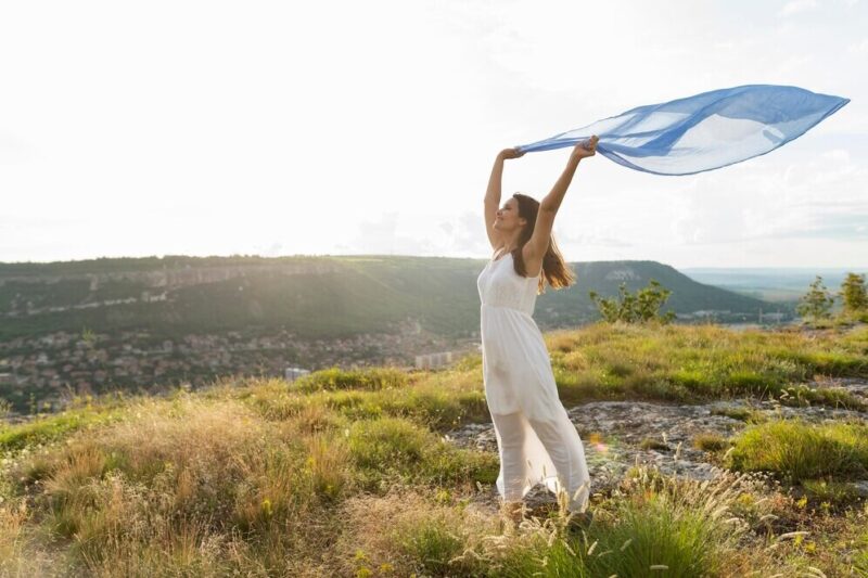 side-view-woman-nature-with-scarf-wind_23-2148614761