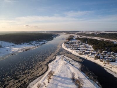 a river running through a snow covered countryside