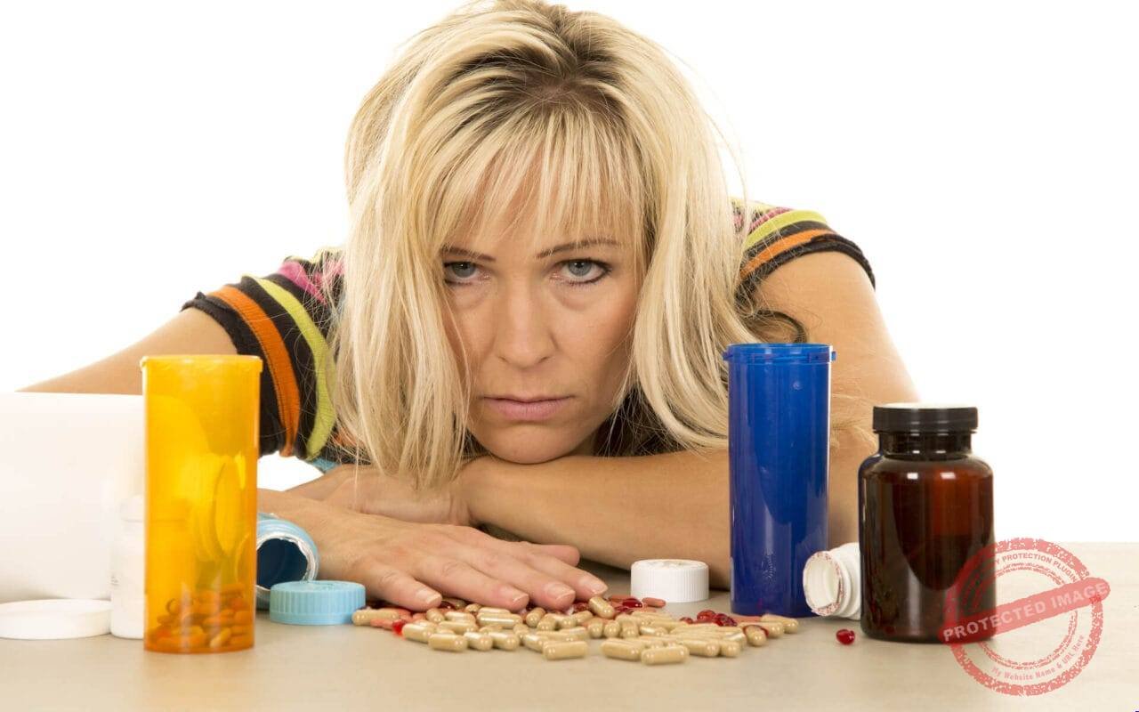 unhappy woman and vitamin pills Straipsniai.lt