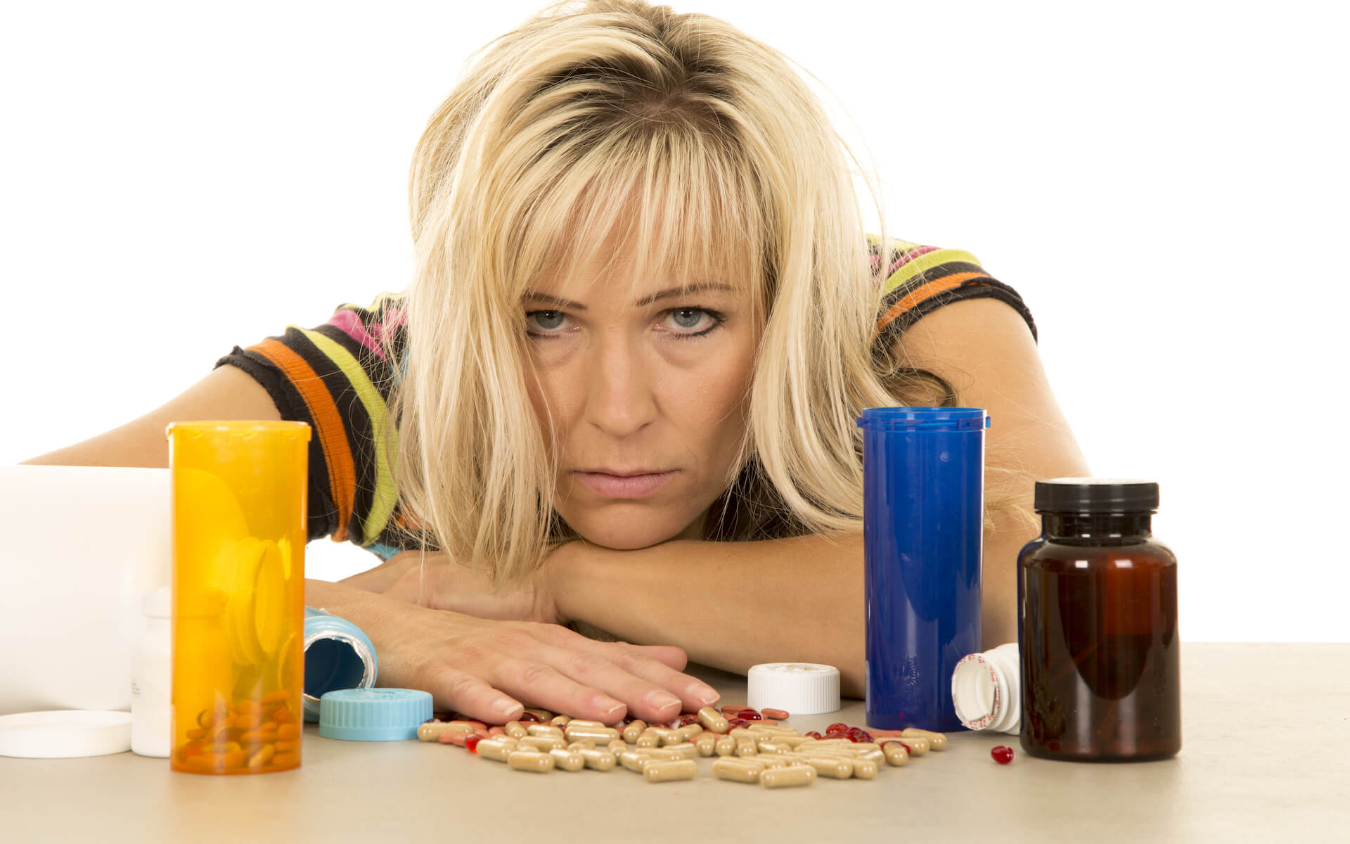 unhappy woman and vitamin pills Straipsniai.lt