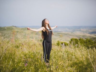 woman-grass-with-hands-apart_23-2147648551