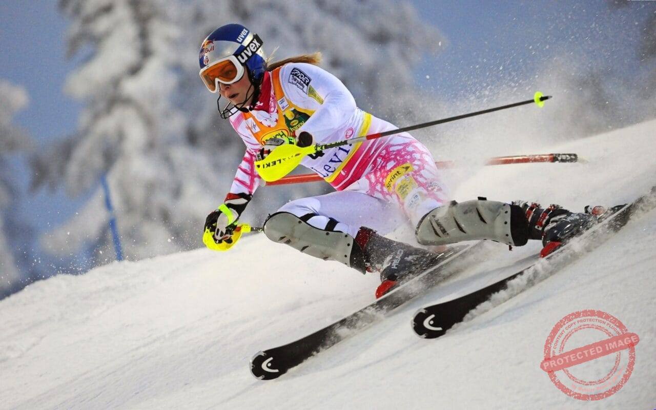 Woman Ski Athlet Racing With Yellow Gloves